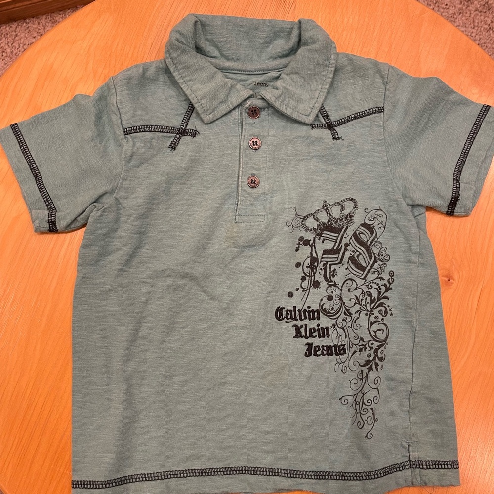 Calvin Klein (size 4) teal buttoned short sleeve polo